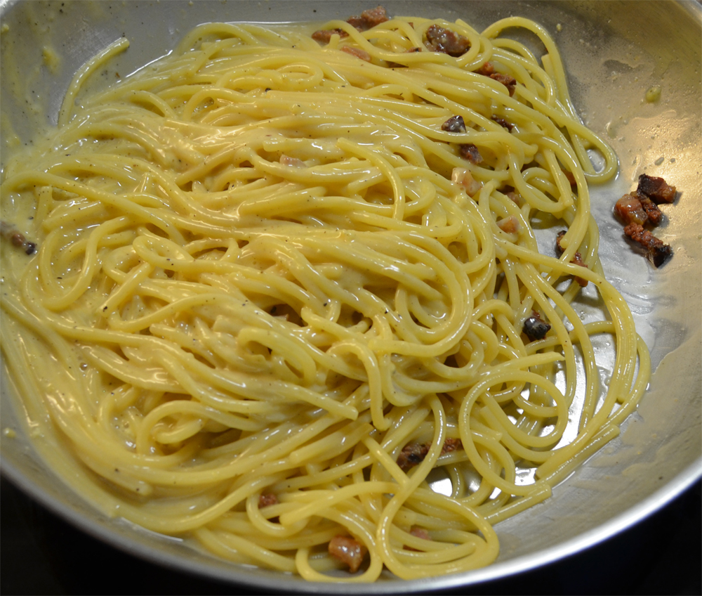 Spaghetti combined with the guanciale and egg mixture