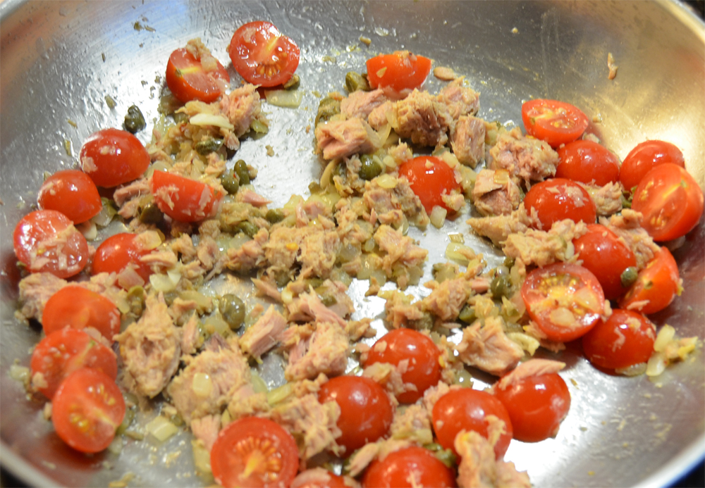 Tomatoes added to the pan.